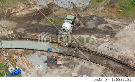 Concrete works for road construction with many workers and mixer timelapse Concrete works for road construction with many workers and mixer timelapse 126522183