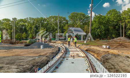 Workers install new tram rails during a reconstruction of the route timelapse. Workers install new tram rails during a reconstruction of the route timelapse. 126522193