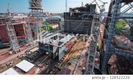 The construction of a large ship on a shipyard with cranes timelapse. The construction of a large ship on a shipyard with cranes timelapse. 126522220