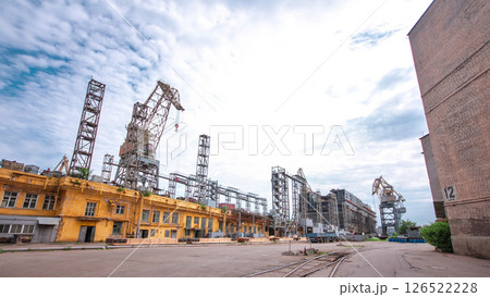 The construction of a large ship on a shipyard with cranes timelapse. 126522228