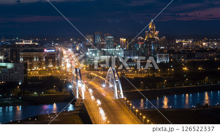 Evening timelapse above the Bridge with the transport and clouds on the background. Central Asia, Kazakhstan, Astana Evening timelapse above the Bridge with the transport and clouds on the background. Central Asia, Kazakhstan, Astana 126522337