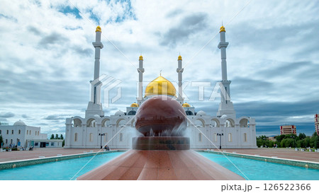 Nur Astana mosque exterior with the fountain at the foreground timelapse hyperlapse in Astana, Kazakhstan. 126522366