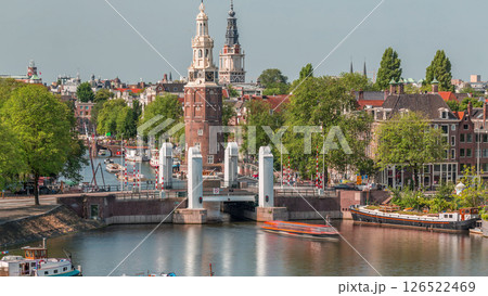 City of Amsterdam aerial timelapse featuring the Montelbaanstoren tower. Netherlands City of Amsterdam aerial timelapse featuring the Montelbaanstoren tower. Netherlands 126522469