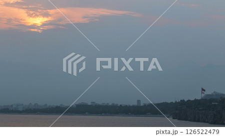 Sunset near Hidirlik tower in Kas town in Turkey timelapse with view of harbor marine bay is a old city 126522479