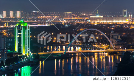 River and illuminated bridge timelapse from rooftop at night in Astana. Kazakhstan capital 126522514