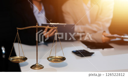 Judge gavel with Justice lawyers having team meeting at law firm background. Concepts of Law and Legal services. Judge gavel with Justice lawyers having team meeting at law firm background. Concepts of Law and Legal services. 126522812