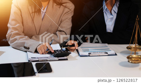 Judge gavel with Justice lawyers having team meeting at law firm background. Concepts of Law and Legal services. Judge gavel with Justice lawyers having team meeting at law firm background. Concepts of Law and Legal services. 126522817