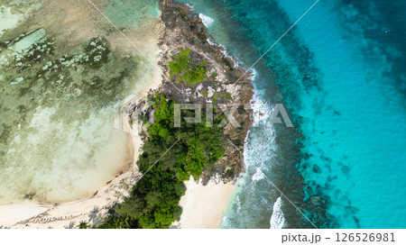 Island beach with white sand, lush tropical vegetation and azure waters. Seychelles, Mahe. 126526981
