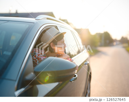 Traveler woman drives car through scenic countryside of Croatia 126527645