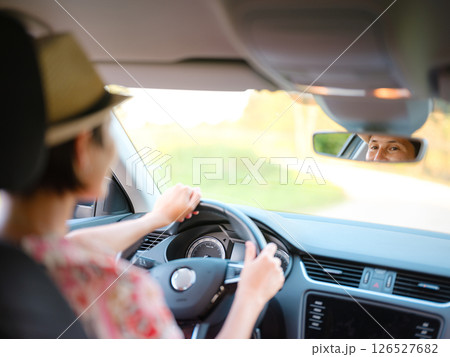 Traveler woman drives car through scenic countryside of Croatia Traveler woman drives car through scenic countryside of Croatia 126527682