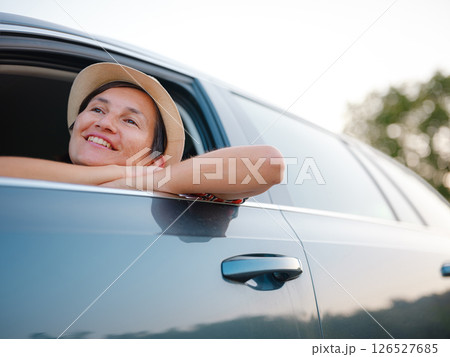 Traveler woman drives car through scenic countryside of Croatia 126527685