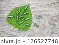 Herbal capsules from green herbal on leaf for healthy eating in daily life 126527748