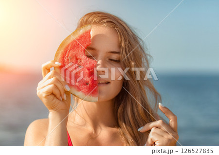 Watermelon Woman Beach Summer: Smiling woman holds watermelon slice, seaside, sunny day, refreshment. Watermelon Woman Beach Summer: Smiling woman holds watermelon slice, seaside, sunny day, refreshment. 126527835