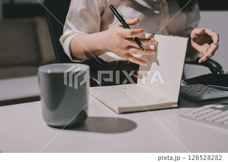Expert woman asian female people review data number costing managerial account prepare monthly actual cost variance report at tax audit office. ESG sheet budget control ERP process service project. Expert woman asian female people review data number costing managerial account prepare monthly actual cost variance report at tax audit office. ESG sheet budget control ERP process service project. 126528282