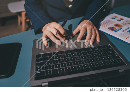 Expert woman asian female people review data number costing managerial account prepare monthly actual cost variance report at tax audit office. ESG sheet budget control ERP process service project. 126528306