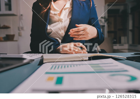 Expert woman asian female people review data number costing managerial account prepare monthly actual cost variance report at tax audit office. ESG sheet budget control ERP process service project. 126528315
