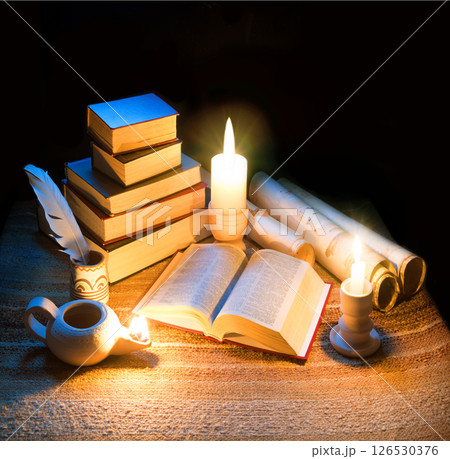 Vintage lamp illuminates old books 126530376