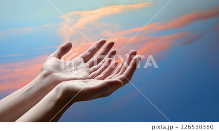 The outstretched hands of a praying man 126530380