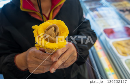 Hand Holding Artisan Gelato Rose Lisbon Portugal. 126532137