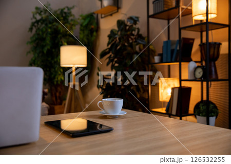 Design a Cozy Home Office with Modern Decor and Warm Lighting for an inviting atmosphere Design a Cozy Home Office with Modern Decor and Warm Lighting for an inviting atmosphere 126532255