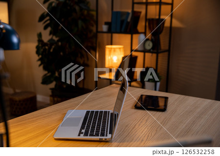 Create a Cozy Home Office Setup Featuring a Laptop and Tablet for Productive Work Days Create a Cozy Home Office Setup Featuring a Laptop and Tablet for Productive Work Days 126532258