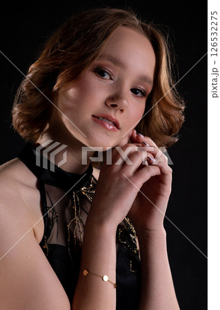 An Elegant and Captivating Portrait of a Beautiful Young Woman in Fashionable Attire An Elegant and Captivating Portrait of a Beautiful Young Woman in Fashionable Attire 126532275