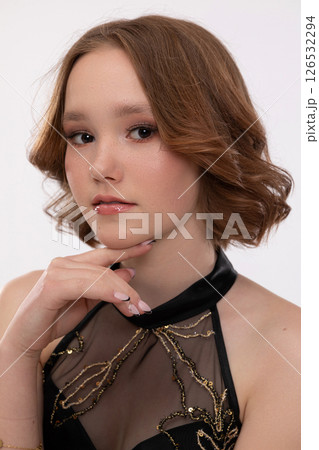 A Stylish and Captivating Portrait of a Young Woman in Fashionable and Elegant Attire A Stylish and Captivating Portrait of a Young Woman in Fashionable and Elegant Attire 126532294