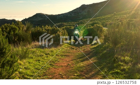 Enduro Motorcycle Rider Driving in High Mountain Landscape, Madeira Island , Portugal 126532758