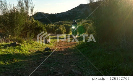 Enduro Motorcycle Rider Driving in High Mountain Landscape, Madeira Island , Portugal Enduro Motorcycle Rider Driving in High Mountain Landscape, Madeira Island , Portugal 126532762