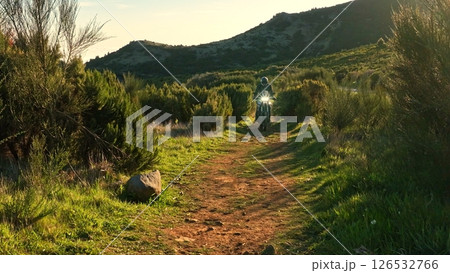 Enduro Motorcycle Rider Driving in High Mountain Landscape, Madeira Island , Portugal Enduro Motorcycle Rider Driving in High Mountain Landscape, Madeira Island , Portugal 126532766