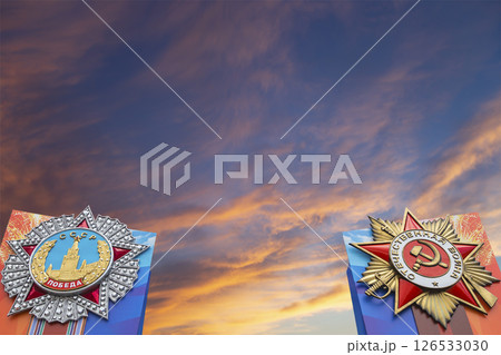 Orders of victory in honor of Victory Day celebration (WWII), Red Square, Moscow, Russia. Against the clouds. Translation from Russian: USSR, Victory, Patriotic war 126533030