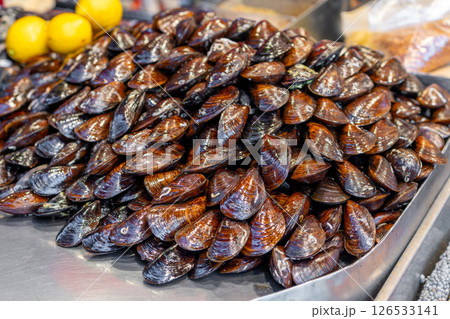A lot of red mussels on sale in the store 126533141