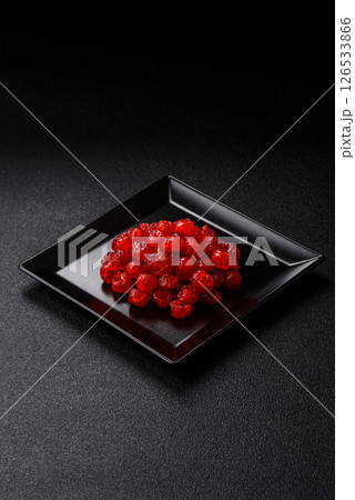 Dried sweet red pitted cherries or candied fruits 126533866