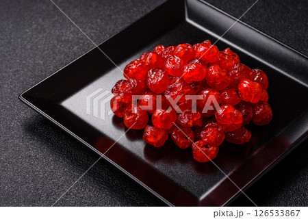 Dried sweet red pitted cherries or candied fruits Dried sweet red pitted cherries or candied fruits 126533867