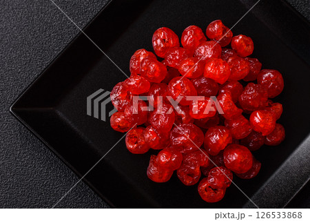 Dried sweet red pitted cherries or candied fruits 126533868