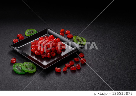 Dried sweet red pitted cherries or candied fruits Dried sweet red pitted cherries or candied fruits 126533875