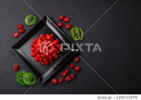 Dried sweet red pitted cherries or candied fruits Dried sweet red pitted cherries or candied fruits 126533876