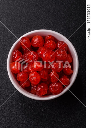 Dried sweet red pitted cherries or candied fruits 126533916
