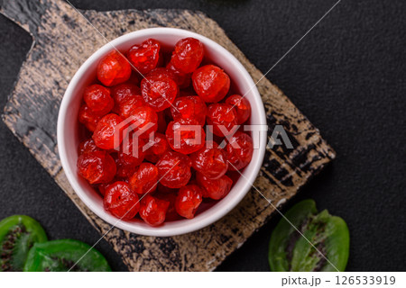 Dried sweet red pitted cherries or candied fruits 126533919