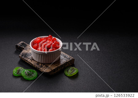 Dried sweet red pitted cherries or candied fruits Dried sweet red pitted cherries or candied fruits 126533922