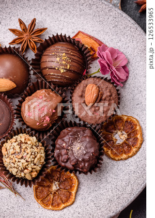 Homemade chocolate candies with different fillings and sprinkles 126533965
