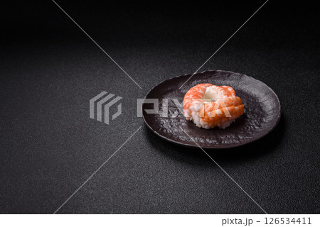 Donut shaped sushi rolls with salmon, shrimp and tuna 126534411