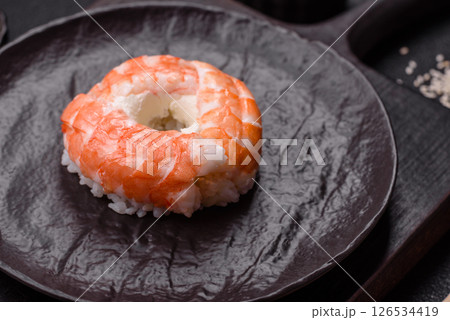 Donut shaped sushi rolls with salmon, shrimp and tuna 126534419