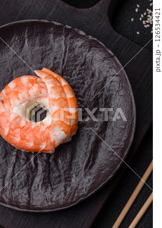 Donut shaped sushi rolls with salmon, shrimp and tuna Donut shaped sushi rolls with salmon, shrimp and tuna 126534421