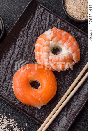 Donut shaped sushi rolls with salmon, shrimp and tuna Donut shaped sushi rolls with salmon, shrimp and tuna 126534433