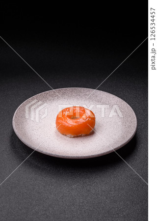 Donut shaped sushi rolls with salmon, shrimp and tuna Donut shaped sushi rolls with salmon, shrimp and tuna 126534457