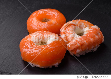 Donut shaped sushi rolls with salmon, shrimp and tuna Donut shaped sushi rolls with salmon, shrimp and tuna 126534462