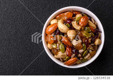 Honeyed cashew nuts, walnuts, hazelnuts, pine nuts and dried fruits Honeyed cashew nuts, walnuts, hazelnuts, pine nuts and dried fruits 126534516