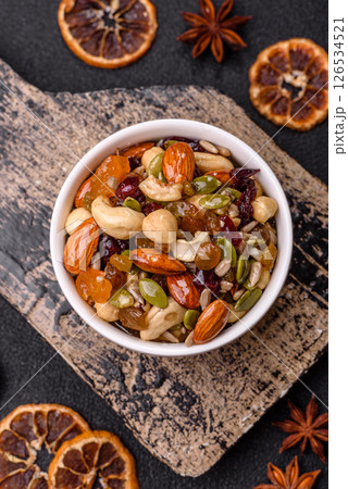 Honeyed cashew nuts, walnuts, hazelnuts, pine nuts and dried fruits 126534521