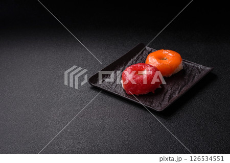 Donut shaped sushi rolls with salmon, shrimp and tuna 126534551